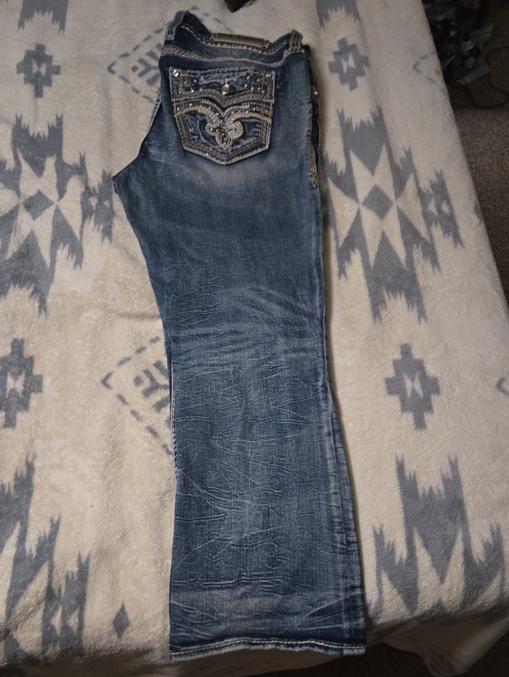 Rock Revival Distressed Blue Boot Cut Jeans with Embellished Pockets